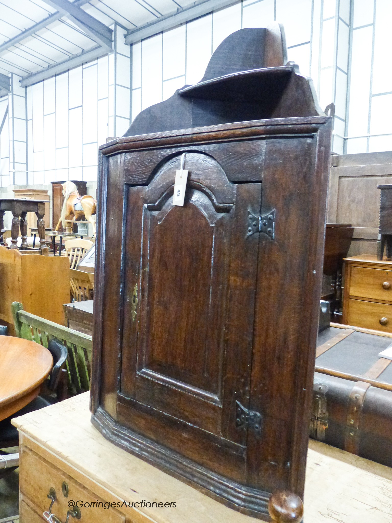 A late 17th century oak hanging corner cupboard